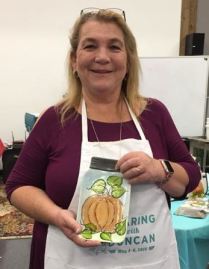 teacher with pumpkin on jar plate