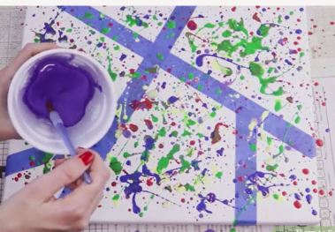 paint spattering canvas